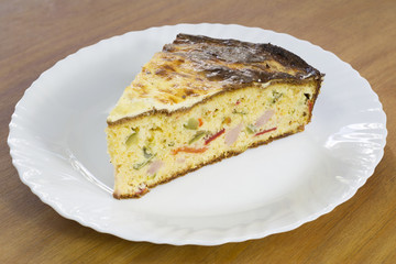 Slice of Freshly Baked Cornbread With Vegetables and Ham