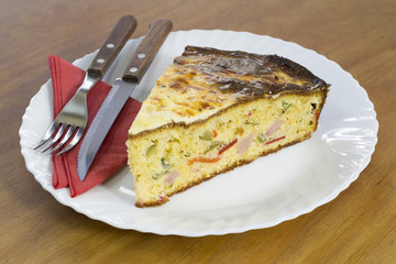 Slice of Freshly Baked Cornbread With Vegetables and Ham