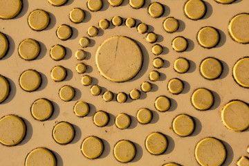 circle pattern texture of yellow plastic plate