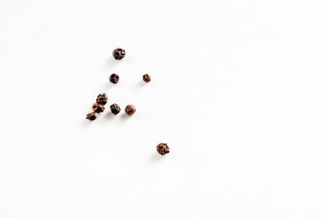 black peppers on the white