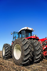 Powerful agricultural tractor in a field