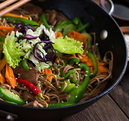 Soba noodles with beef, carrots, onions and sweet peppers