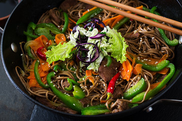 Soba noodles with beef, carrots, onions and sweet peppers