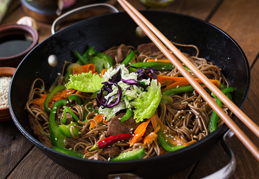 Soba noodles with beef, carrots, onions and sweet peppers