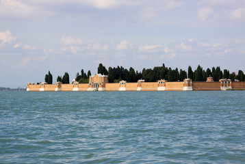 Fototapeta premium VENICE, ITALY - SEPTEMBER 02, 2012: View from the Venice lagoon on the wall of cemetery island of San Michele, Venice, Italy