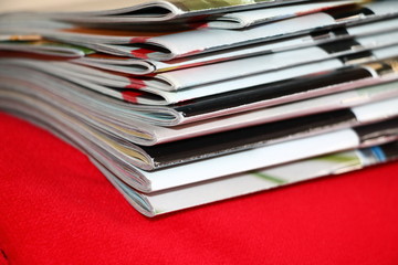 Magazines on the red sofa