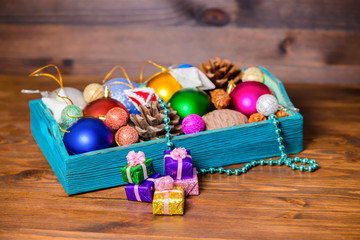 composition of vintage wooden box with Christmas decoration, tin