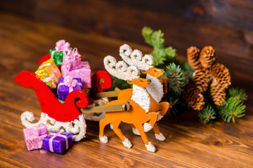 composition of Christmas decoration reindeer and Santa sleigh ha