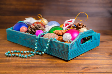 composition of retro wooden box with Christmas decoration, tinse