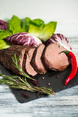 Sliced meat with thyme