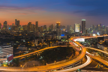 City highway interchanged with central business downtown background
