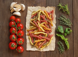 Colorful pasta, vegetables and herbs