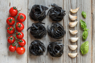  Black Tagliatelle pasta with cherry tomatoes, garlic and basil