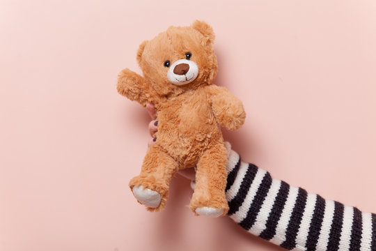 Naklejka Hand holding teddy bear