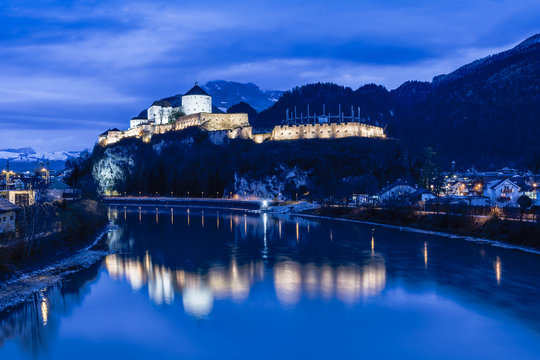 Castle Kufstein reflecting in Inn river in Austria - architecture and travel background