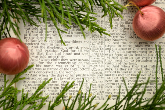 Christmas Story, Open Bible With Ornaments And Greenery