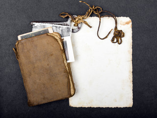 Rusty key, old book and empty photography as a memory metaphor