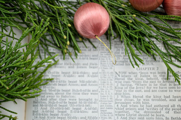 Christmas story and greenery with pink ornaments
