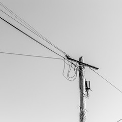 view of an old electric pole with wire