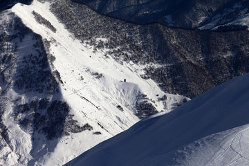 View from off-piste slope on snowy canyon