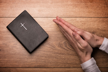 Cheerful girl is asking Got for forgiveness