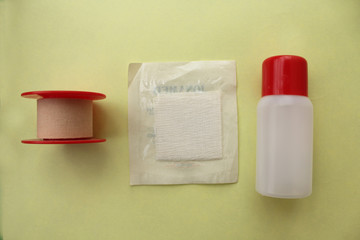 Bandage, bottle and gauze - first aid concept
