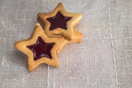 Star shaped jam and butter cookies, christmas