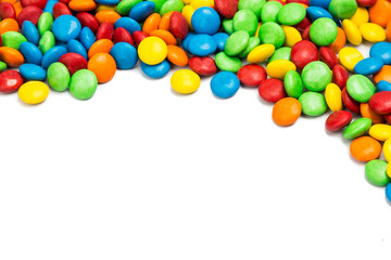 Top right frame of colorful chocolate candy on white background