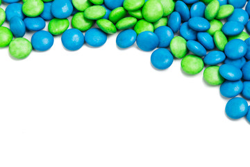 Top rame of blue green chocolate candy on white background