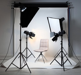 Photo studio with modern interior and lighting equipment