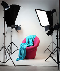 Photo studio with modern interior and lighting equipment