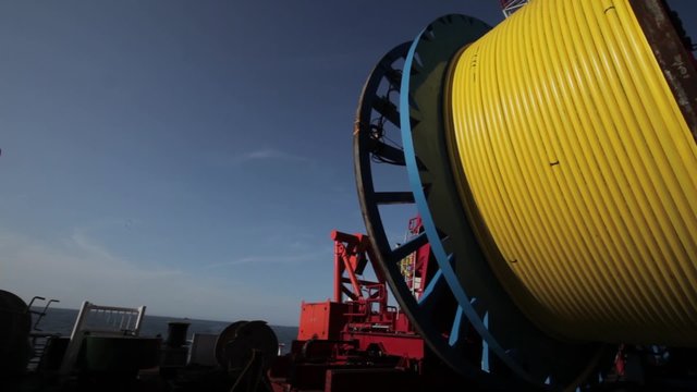 Laying of underwater optical cable on sea bottom