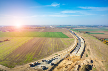Sunset over road under construction