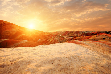 Fototapeta na wymiar landscape of red sandstone in sunrise in zhangye