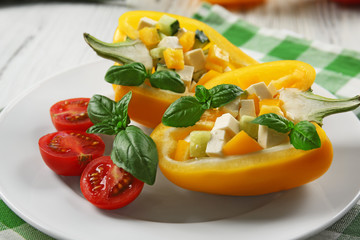 Fresh green salad in pepper on table close up