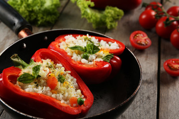 Stuffed peppers with vegetables on table close up