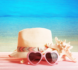 Summer accessories on sea background