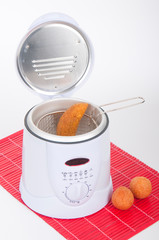 Electric Fryer on neutral white background