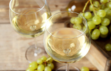 Still life of wine and bread on light background