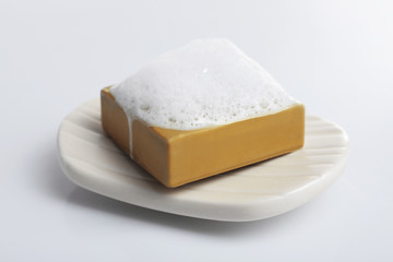 Soap with foam isolated on white