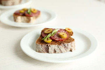 Tasty sandwiches on plates, close up