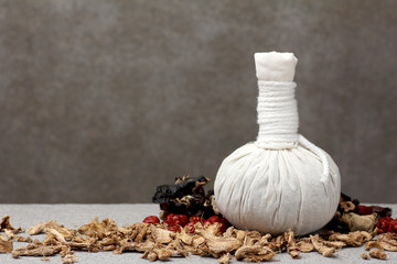 white cloth herbal compress ball