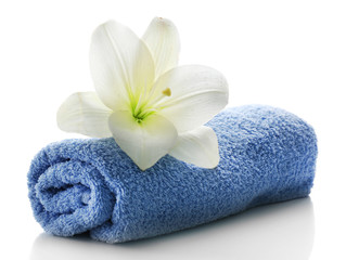 Obraz na płótnie Canvas Blue towel with flower isolated on white background