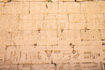 old egypt hieroglyphs carved on the stone