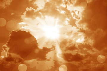 Fototapeta na wymiar Shining sun at clear orange sky and lens flare with copy space