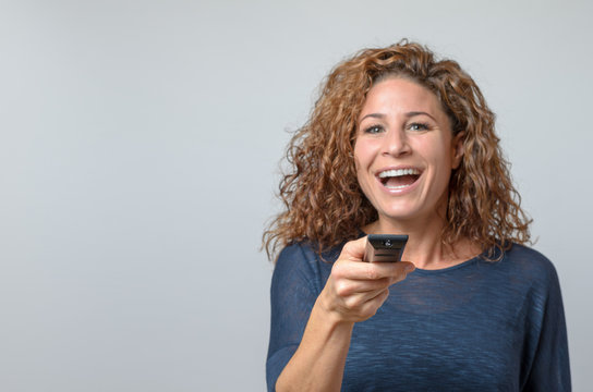 Woman Holding A Remote Control