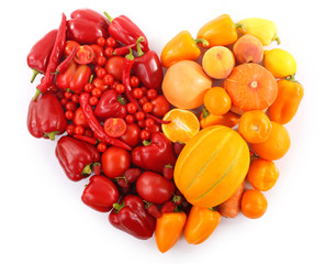 Heart-shaped composition of various raw organic vegetables isolated on white