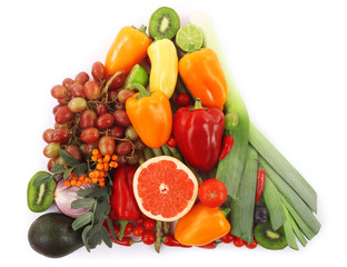 Close-up composition of various raw organic vegetables and fruit isolated on white
