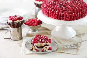 Sweet cake with raspberries on light background