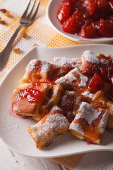 Austrian Kaiserschmarrn with plum sauce close-up. Vertical
